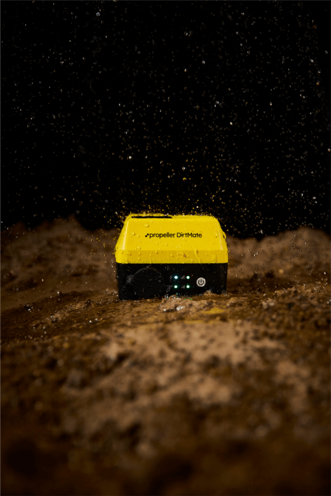 Propeller DirtMate in dirt with water splashing on it