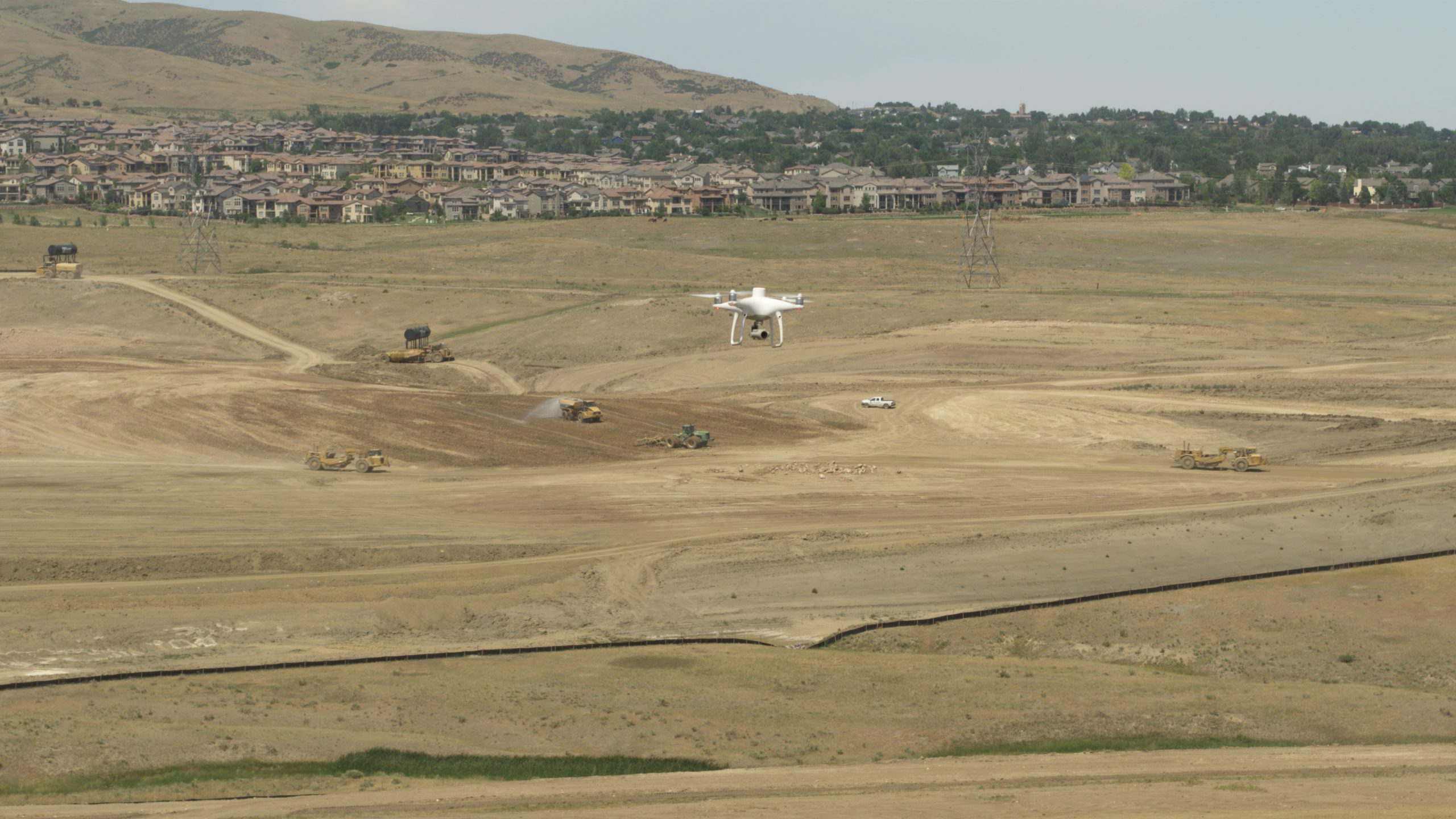 drone flying over construction site