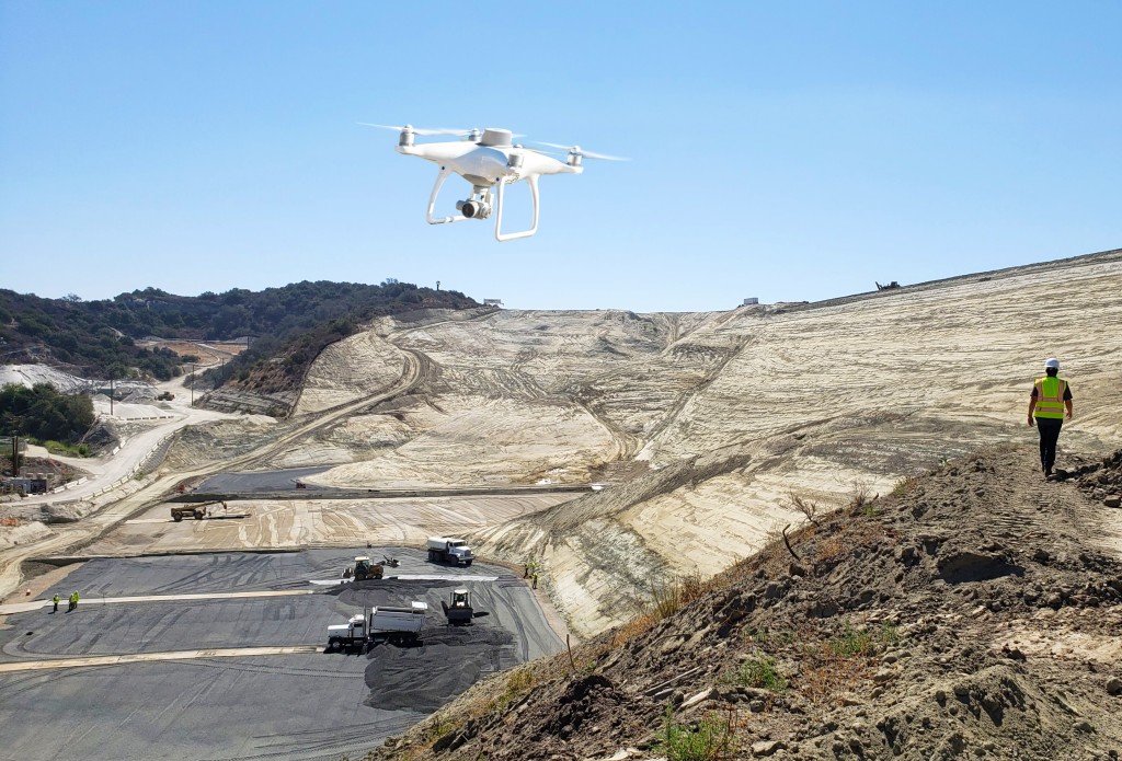 drone flying above a landfill