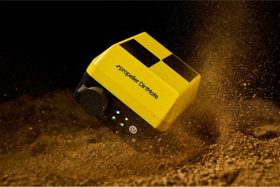 Dirtmate falling into a pile of dirt