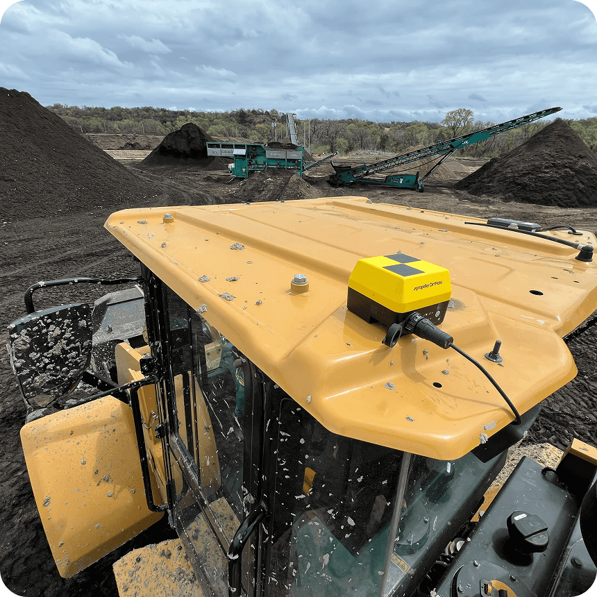 dirtmate on top of an excavator